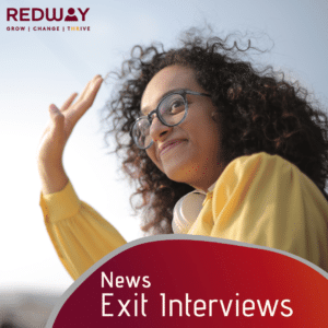 A lady with a yellow jumper waving goodbye.